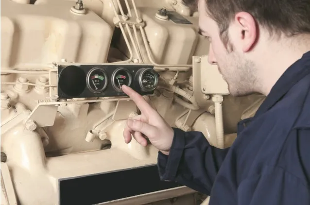 load bank testing commercial residential standby generator man checking gauge national standby repair