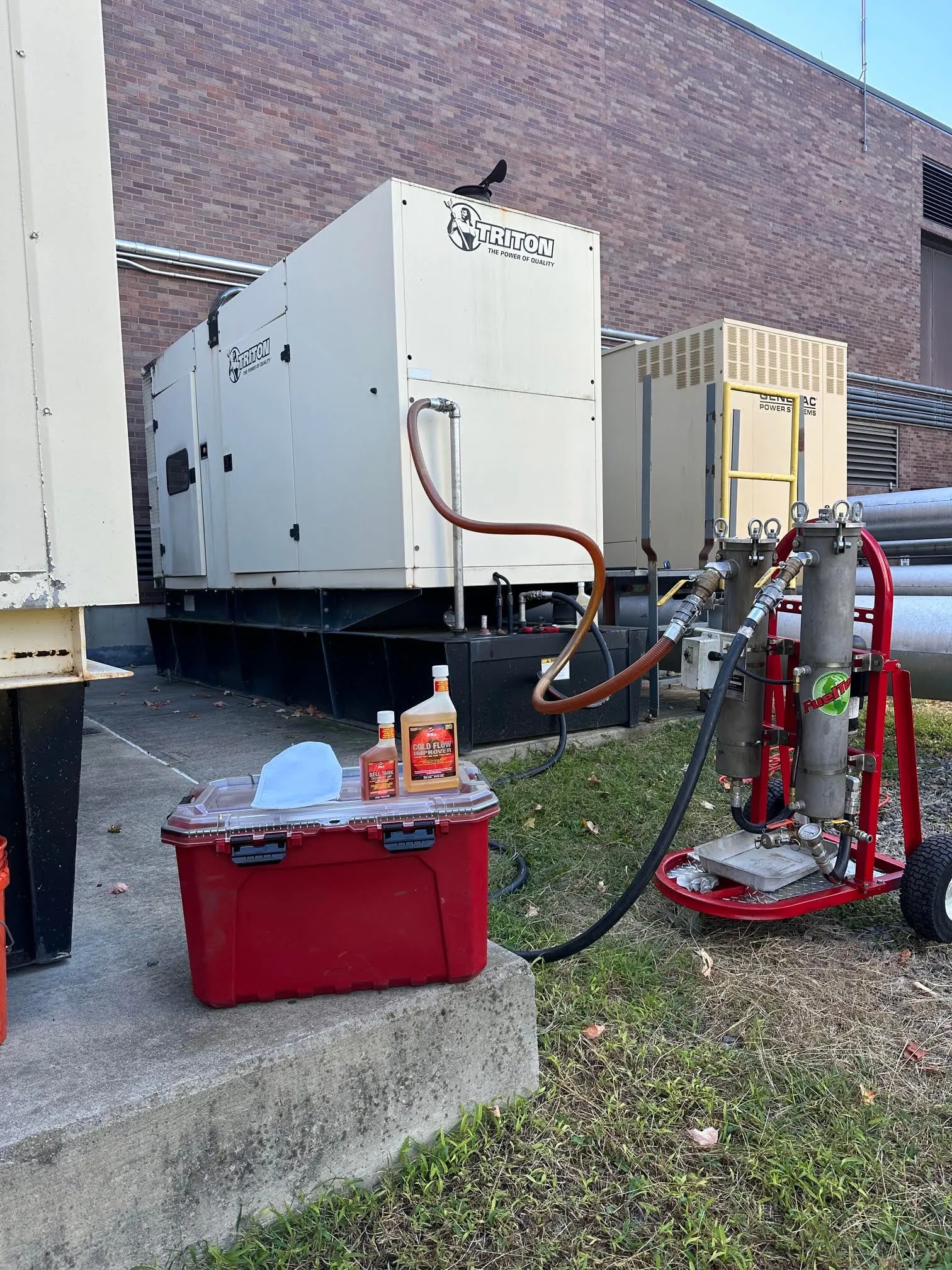 Fuel polishing cart filtering the diesel tank of a commercial standby generator
