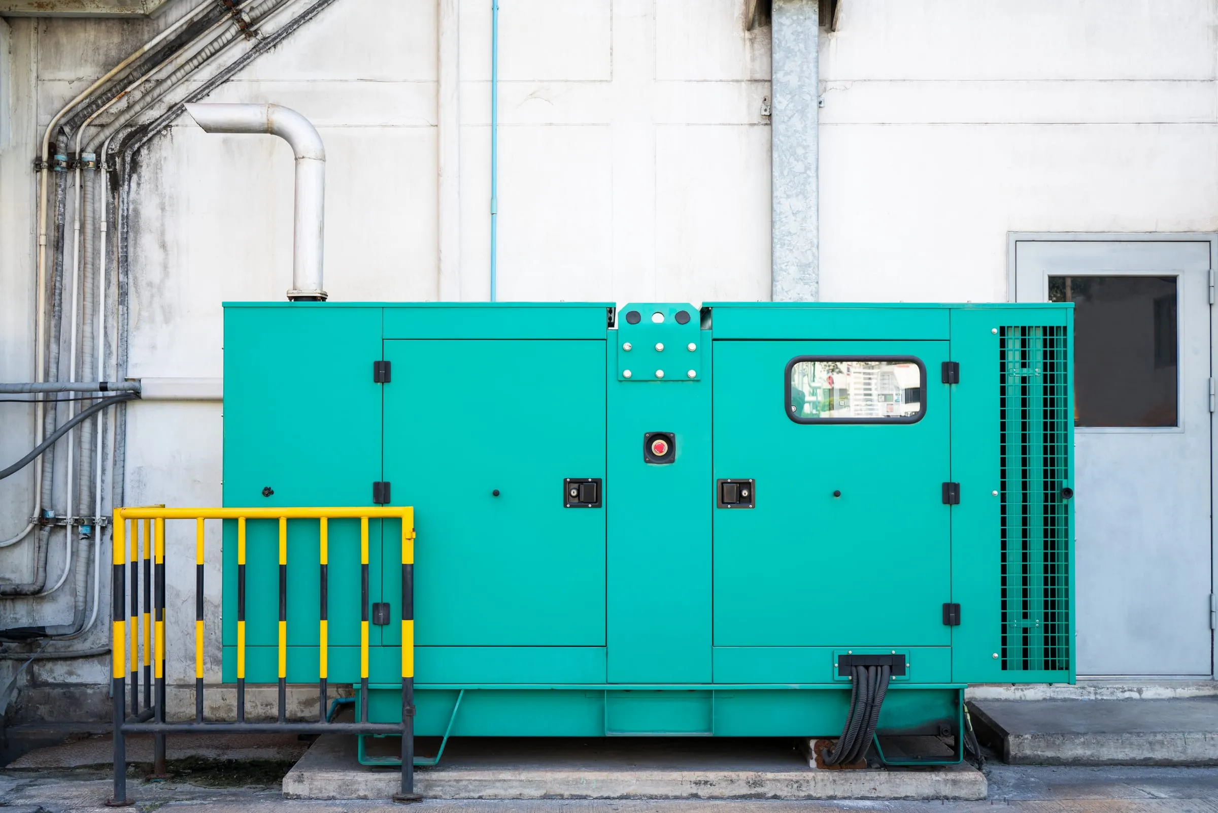 Technician testing a Winco standby generator