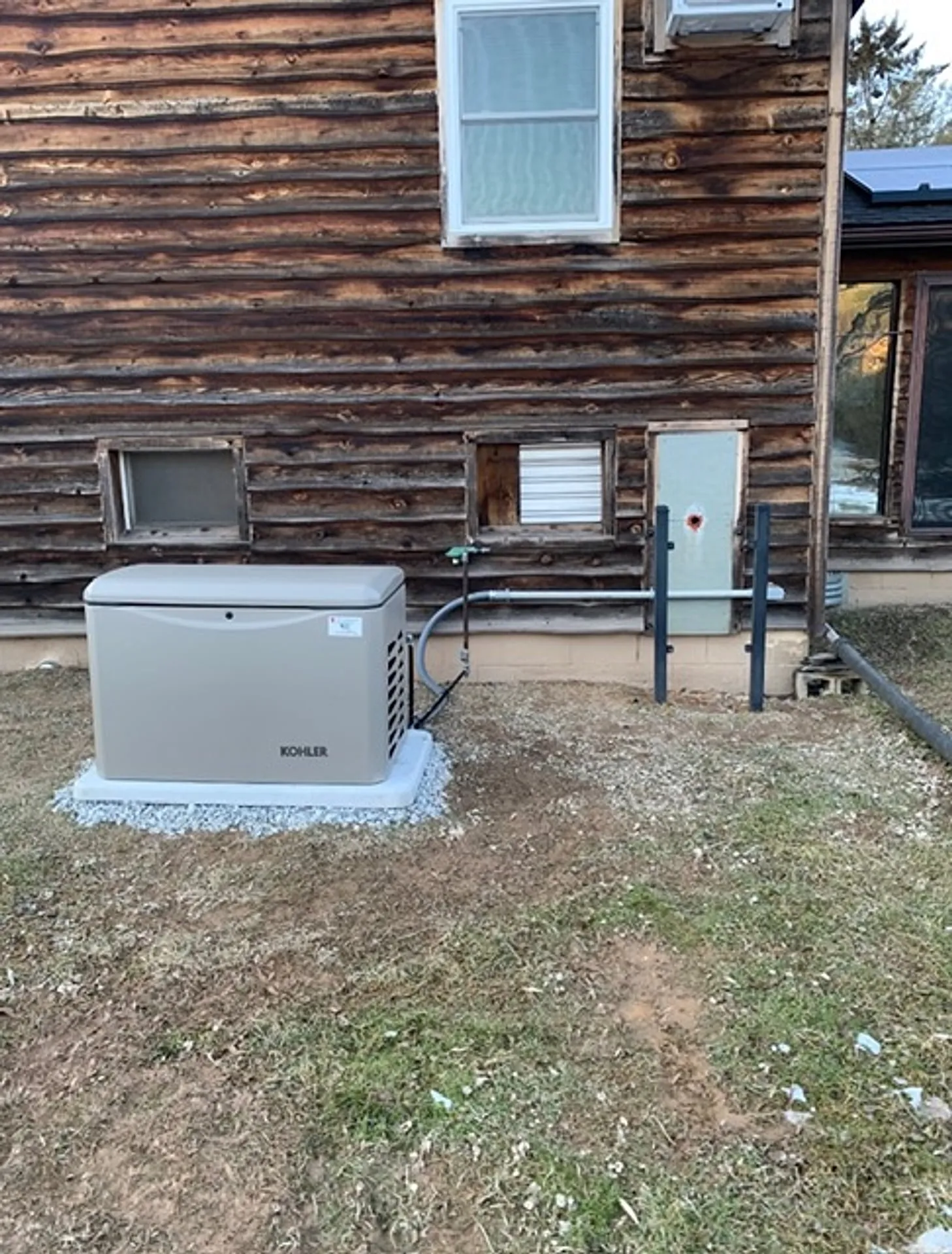 Standby generator installed beside a family home