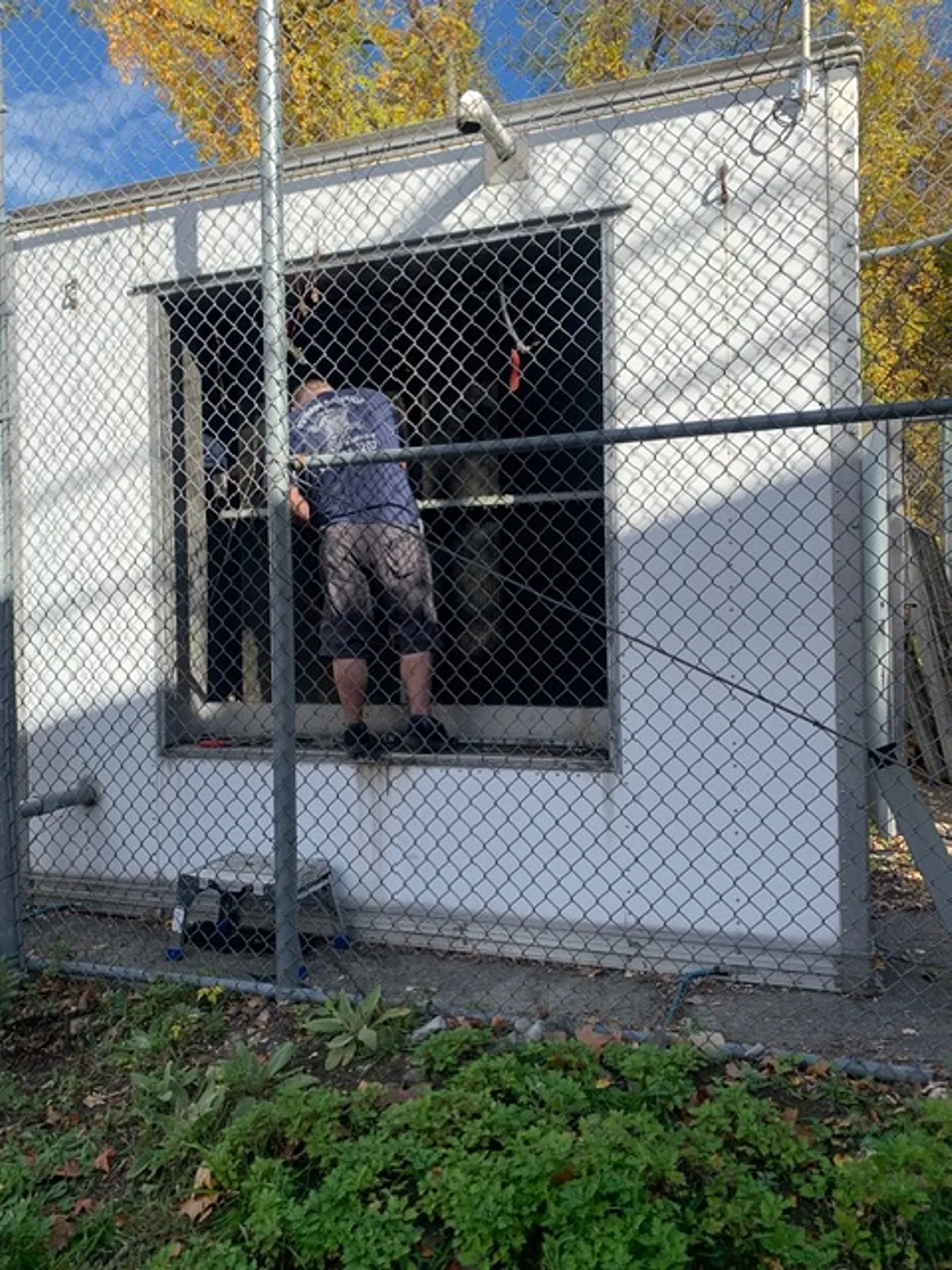 National Standby Repair technician working inside a generator enclosure