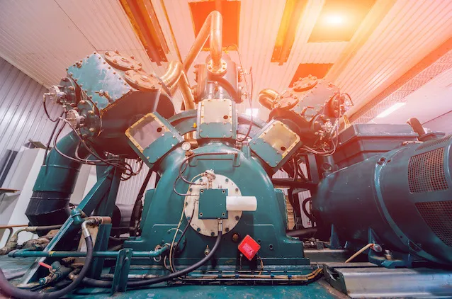 Standby diesel generator at the factory. Radiator and fuel filter system. Background
